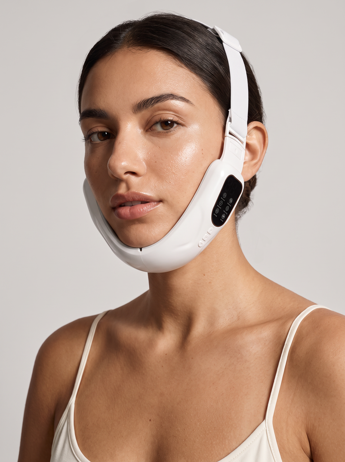 Woman wearing the Facial Slimming Device V-band