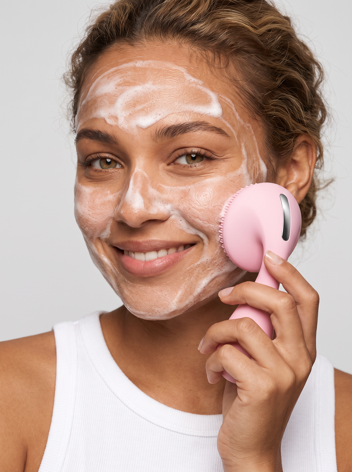 Woman cleansing her face with the Silicone Facial Cleansing Device